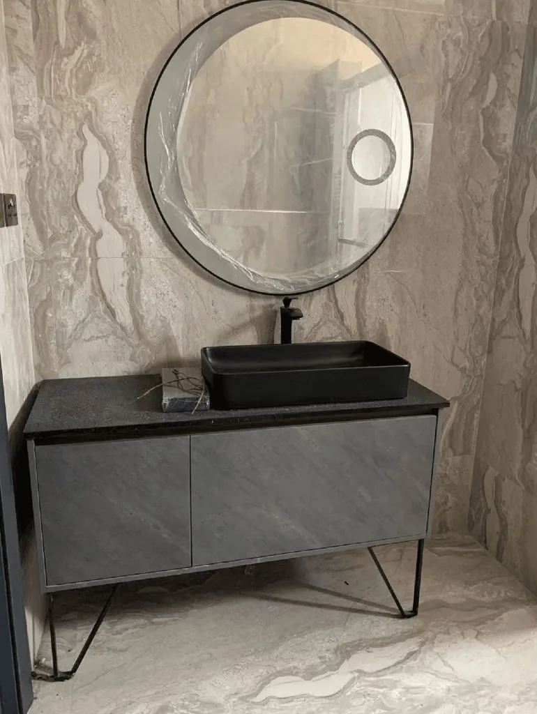Bathroom cabinetry installation at a Malawi apartment project
